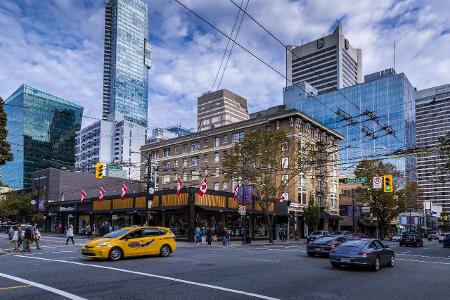 View of traffic and shoppers on Robson Street, Vancouver, Br...