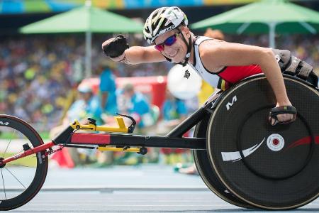 Belgian athlete Marieke Vervoort celebrates after winning th...