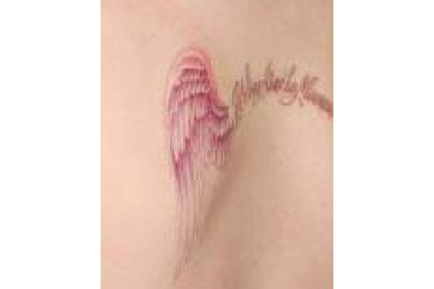kelly-osbourne-wenn-tattoo.jpg