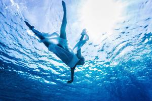 Enjoying refreshing water, silhouette of woman s body in the...