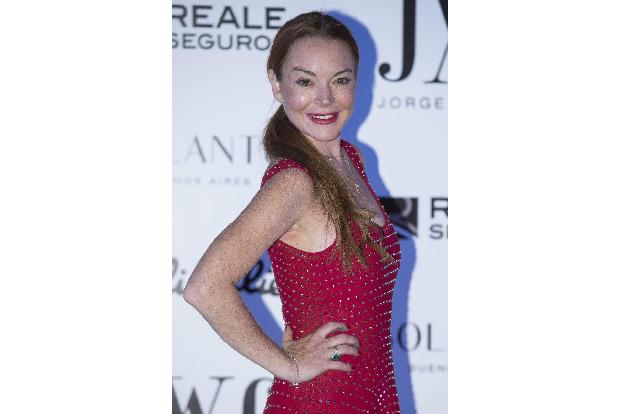 ...Lindsay Lohan, als sie 2012 in der VIP-Loge eines Clubs saß. Eine Frau wollte ihr die Zukunft vorhersagen, doch Lindsay b...