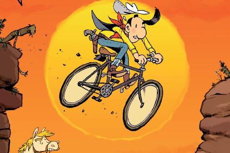 Lucky Luke sattelt aufs Fahrrad um - sehr zum Ärger von Jolly Jumper