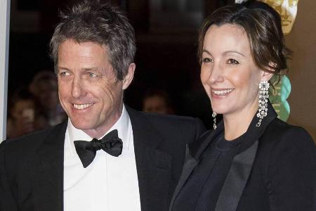 Hugh Grant und Anna Eberstein in London