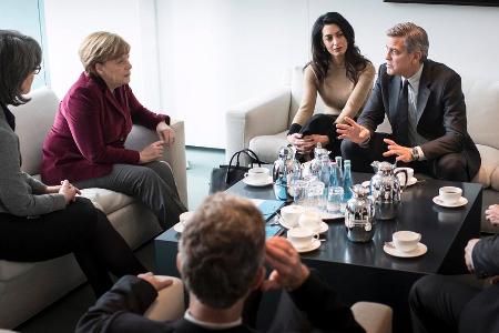 Nicht wie in Hollywood: Amal und George Clooney (r.) bei Bundeskanzlerin Angela Merkel (l.)