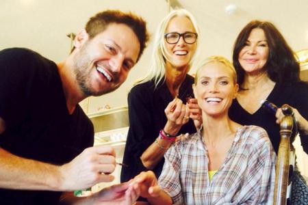 Model-Mama Heidi Klum lässt sich ebenfalls gerne verwöhnen: Gleich drei Paar Hände machten die 42-Jährige bereit für ihren A...