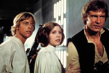 Prinzessin Leia (Carrie Fisher) zwischen Luke Skywalker (Mark Hamill) und Han Solo (Harrison Ford)