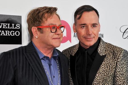 Top-Gastgeber: Elton John (l.) mit Ehemann David Furnish auf ihrer Oscar-Party 2014