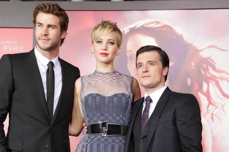 Jennifer Lawrence mit ihren Co-Stars Liam Hemsworth (l.) und Josh Hutcherson