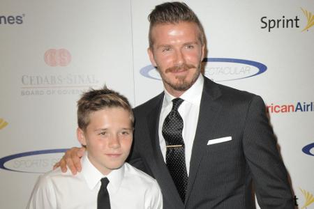 Routiniers auf dem roten Teppich: David Beckham und sein Sohn Brooklyn