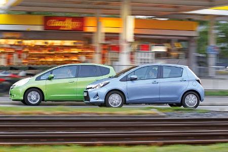 Honda Jazz 1.3 DSi i-VTEC IMA Exclusive, Toyota Yaris 1.5 VVT-i Hybrid Life, Seitenansicht