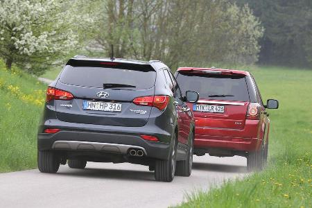 Hyundai Santa Fe 2.2 CR Di 4WD, Land Rover Freelander 2.2 SD4, Heckansicht