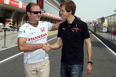 Zwei F1-Generationen im Smalltalk: Rubens Barrichello und Sebastian Vettel.