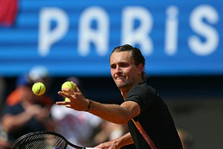 Beste Laune in der Tennis-WG: Einer bügelt, einer klebt