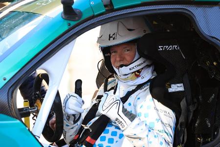 Fürst Albert II. zeigt sich gut gelaunt im Rennanzug