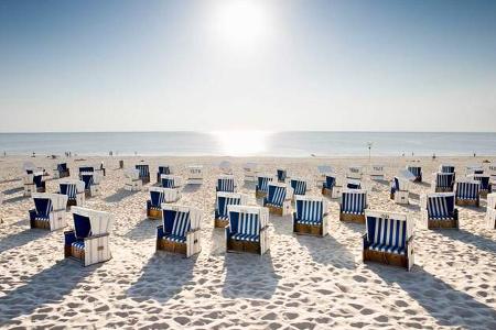 Wicker chairs on beach 