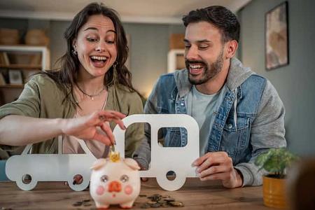 Young couple saving money for camper van road trip