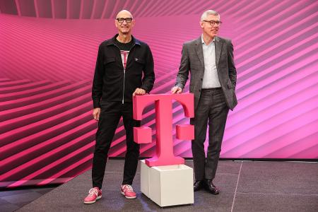 Die Magenta-Manager Tim Höttges (links) und Christian Illek.