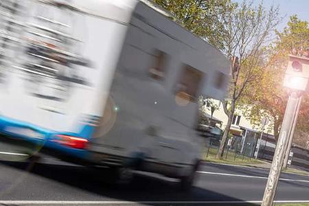 Speed control camera with fast white motorhome Brandenburg, Germany, Geschwindigkeitskontrolle Wohnmobil und Blitzer