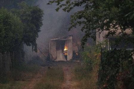 Dutzende Gebäude wurden ein Raub der Flammen.