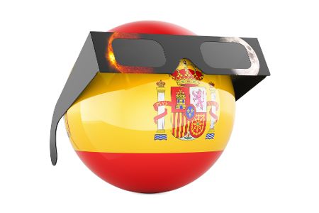 Grafik einer Kugel mit der spanischen Fahne, die eine Brille für eine Sonnenfinsternis trägt